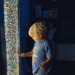 A young child at MOXI plays on a screen of brightly lit squares. (Courtesy photo)